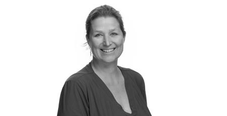 Black-and-white photo of a woman smiling